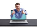 Happy man got out of the laptop Royalty Free Stock Photo