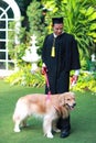 Happy asian man graduated holding and showing degree with his dog, idea for education concept Royalty Free Stock Photo