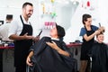 Man hairdresser talking to woman