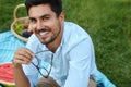 Happy Man. Handsome Smiling Young Male Outdoors In Park Royalty Free Stock Photo