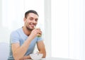 Happy man having breakfast at home Royalty Free Stock Photo