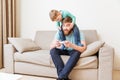 Happy man with his son on shoulders playing computer games Royalty Free Stock Photo