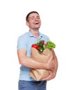 Happy man hold bag with healthy food, grocery buyer isolated Royalty Free Stock Photo