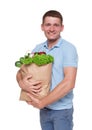 Happy man hold bag with healthy food, grocery buyer isolated Royalty Free Stock Photo