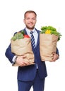 Happy man hold bag with healthy food, grocery buyer isolated Royalty Free Stock Photo