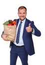 Happy man hold bag with healthy food, grocery buyer isolated Royalty Free Stock Photo