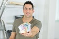 Happy man holding dummy house Royalty Free Stock Photo