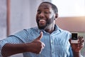 Happy man holding an engagement ring Royalty Free Stock Photo