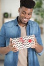 happy man holding gift wrapped present Royalty Free Stock Photo