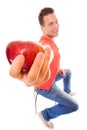 Happy man in holding offering apple. Diet health care healthy nutrition.