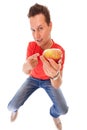 Happy man in holding offering apple. Diet health care healthy nutrition.