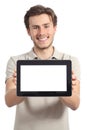 Happy man holding and showing a blank horizontal tablet screen