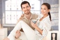 Happy man holding woman in his arms smiling Royalty Free Stock Photo