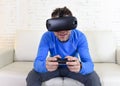 Happy man at home living room sofa couch excited using 3d goggles watching 360 virtual reality
