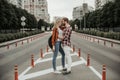 Happy man hugging his beloved woman at street