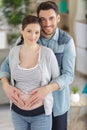 happy man hugging pregnant wife Royalty Free Stock Photo