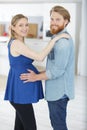 Happy man hugging pregnant wife at home Royalty Free Stock Photo