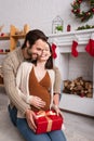 happy man hugging pregnant wife sitting Royalty Free Stock Photo