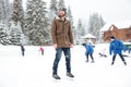 Happy man in ice skates looking away outdoors Royalty Free Stock Photo