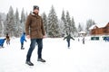 Happy man ice skating outdoors Royalty Free Stock Photo