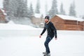 Happy man ice skating outdoors Royalty Free Stock Photo