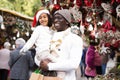 Happy man with joyful daughter Christmas fair