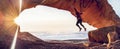 Happy man jumping for joy on the rocky mountains, sunrise light. Royalty Free Stock Photo