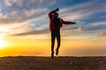 Happy man jumping for joy at sunset. Success, winner, happiness, ttavel concept Royalty Free Stock Photo