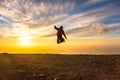 Happy man jumping for joy at sunset. Success, winner, happiness, ttavel concept Royalty Free Stock Photo