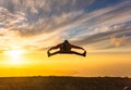 Happy man jumping for joy at sunset. Success, winner, happiness, ttavel concept Royalty Free Stock Photo