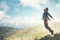 Happy Man jumping at mountains to clouds sky Royalty Free Stock Photo