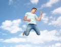 Happy man jumping and playing imaginary guitar Royalty Free Stock Photo