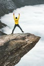 Happy Man jumping on Trolltunga rocky cliff edge Royalty Free Stock Photo