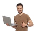 Happy man with laptop showing thumbs up on white background Royalty Free Stock Photo