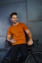 Happy man leaning against bicycle Royalty Free Stock Photo