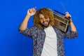 Happy man listening music on retro tape record player disco dancing fan of vintage technologies Royalty Free Stock Photo