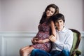 A happy man is lovingly holding his pregnant wife belly. Royalty Free Stock Photo