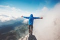 Happy Man on mountain summit enjoying aerial view Royalty Free Stock Photo