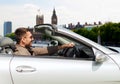 Happy man near cabriolet car over london city Royalty Free Stock Photo
