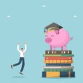 Happy man near stack of books and piggy bank