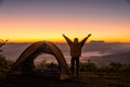 Happy people with arms open near the tents around the mountains Royalty Free Stock Photo