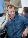 Happy man, phone call and meeting with discussion in boardroom for networking or chatting at office. Creative male Royalty Free Stock Photo