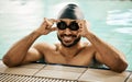 Happy, man and portrait of athlete in swimming pool with gear for training, workout or exercise for wellness, health or Royalty Free Stock Photo