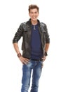 Happy man, portrait and fashion with leather jacket, denim jeans or cool clothing on a white studio background Royalty Free Stock Photo