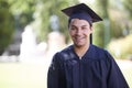 Happy man, portrait and outdoor graduation for education, learning or qualification in career ambition. Male person