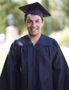 Happy man, portrait and outdoor graduation for qualification, learning or career ambition in education. Male person