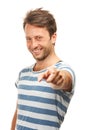 Happy man, portrait and pointing to you for choice or pick on a white studio background. Isolated, handsome male person