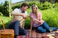 Happy man pouring wine in glass held by woman Royalty Free Stock Photo