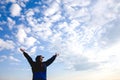 Happy man raised wide open arms traveling hiker blue sky and clouds healthy lifestyle adventure vacations outdoor success joyful Royalty Free Stock Photo