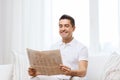 Happy man reading newspaper at home Royalty Free Stock Photo